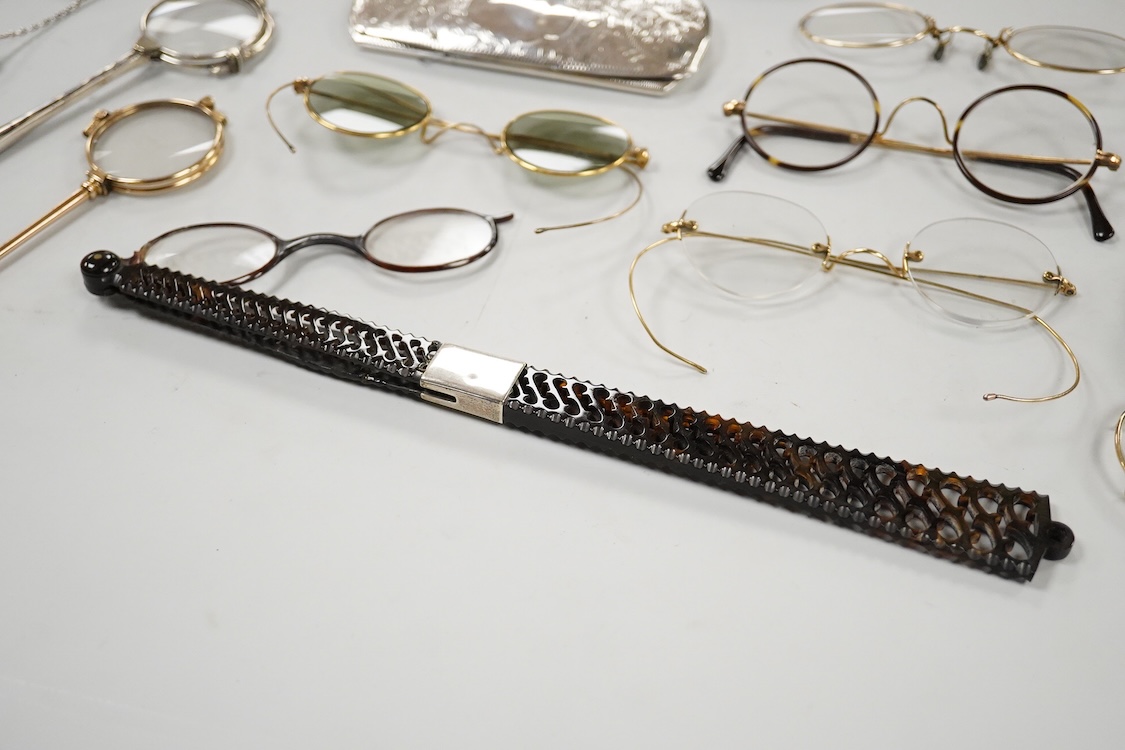 An Edwardian engraved silver spectacle case, by Boots Pure Drug Company, Chester, 1903, one other engraved silver spectacles case, hallmarks rubbed, a pair of 830 standard white metal and niello lorgnettes, two other pai